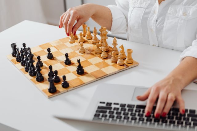 Person Playing a Game of Chess